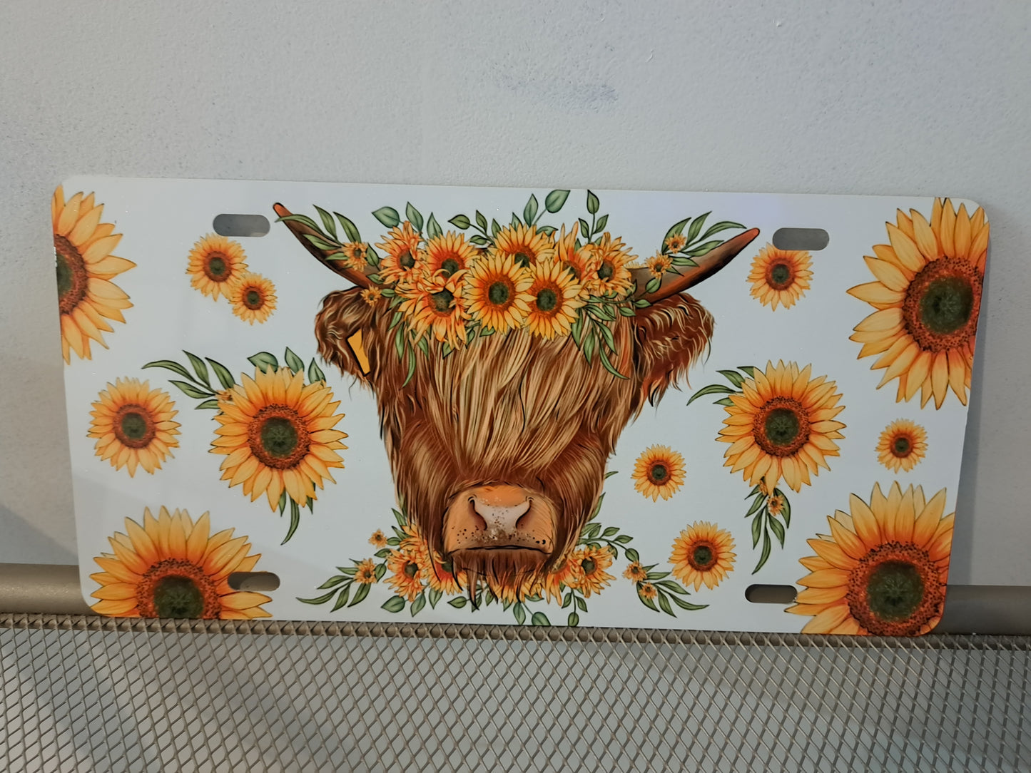 Cow and sunflower license plate